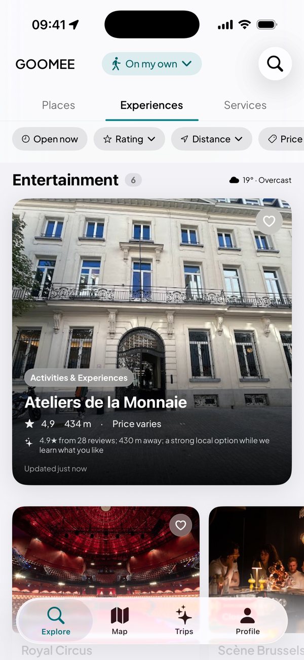 The GOOMEE app's Experiences tab, suggesting entertainment in Brussels